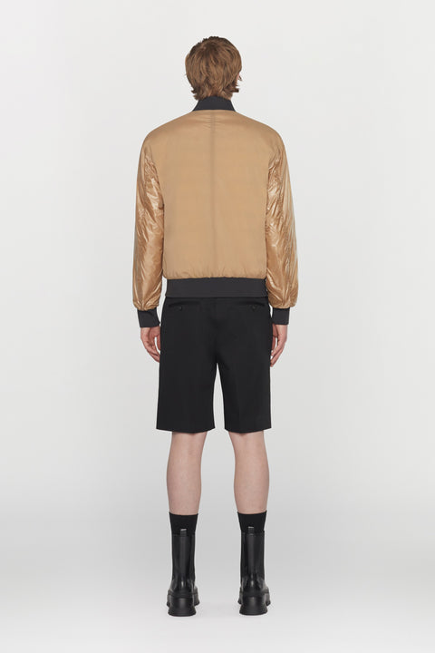 Reversible bomber jacket in water- repellent technical fabric with ribbed details