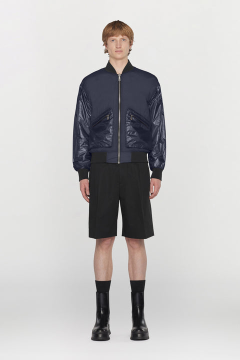 Reversible bomber jacket in water- repellent technical fabric with ribbed details